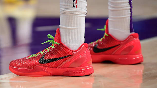 View of red and black Nike Kobe shoes.